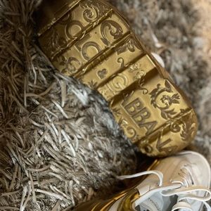 Daymaster sneakers with contrasting mirrored gold bottom.